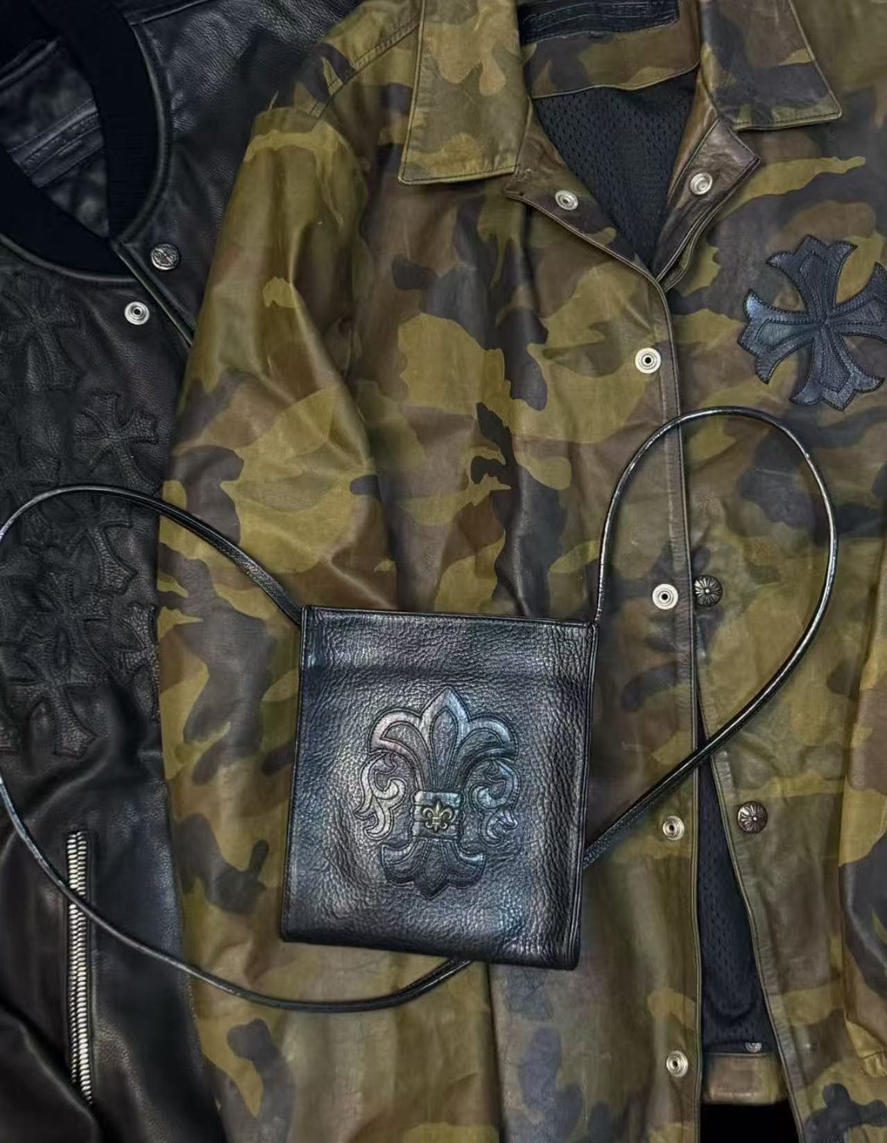 Leather accessories styled with a camouflage jacket