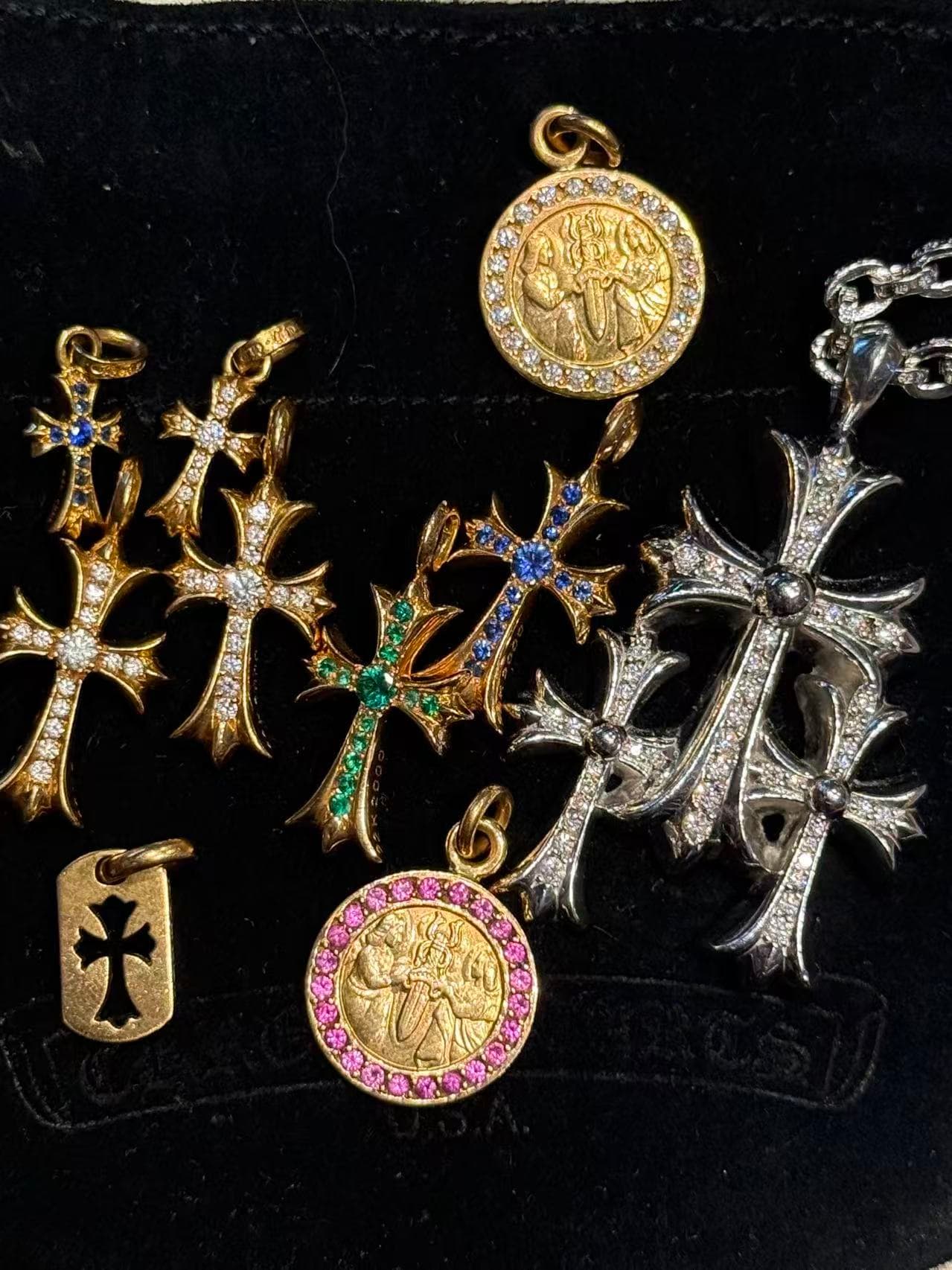 Chrome Hearts pendants arranged on black velvet